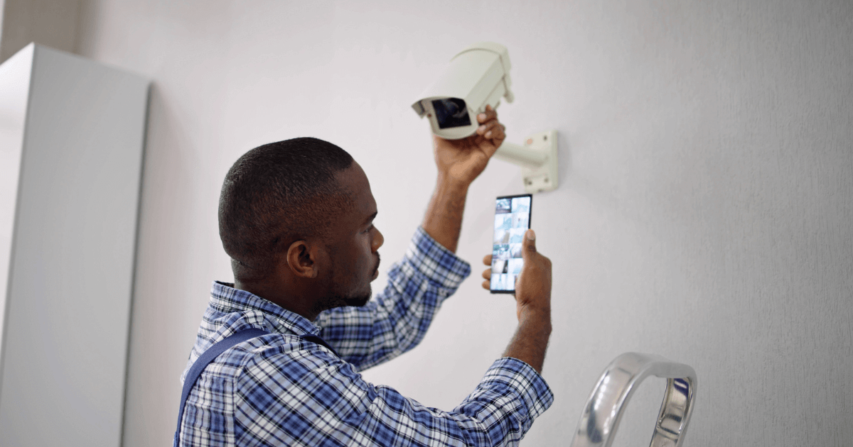 Man installing a camera for senior living monitoring